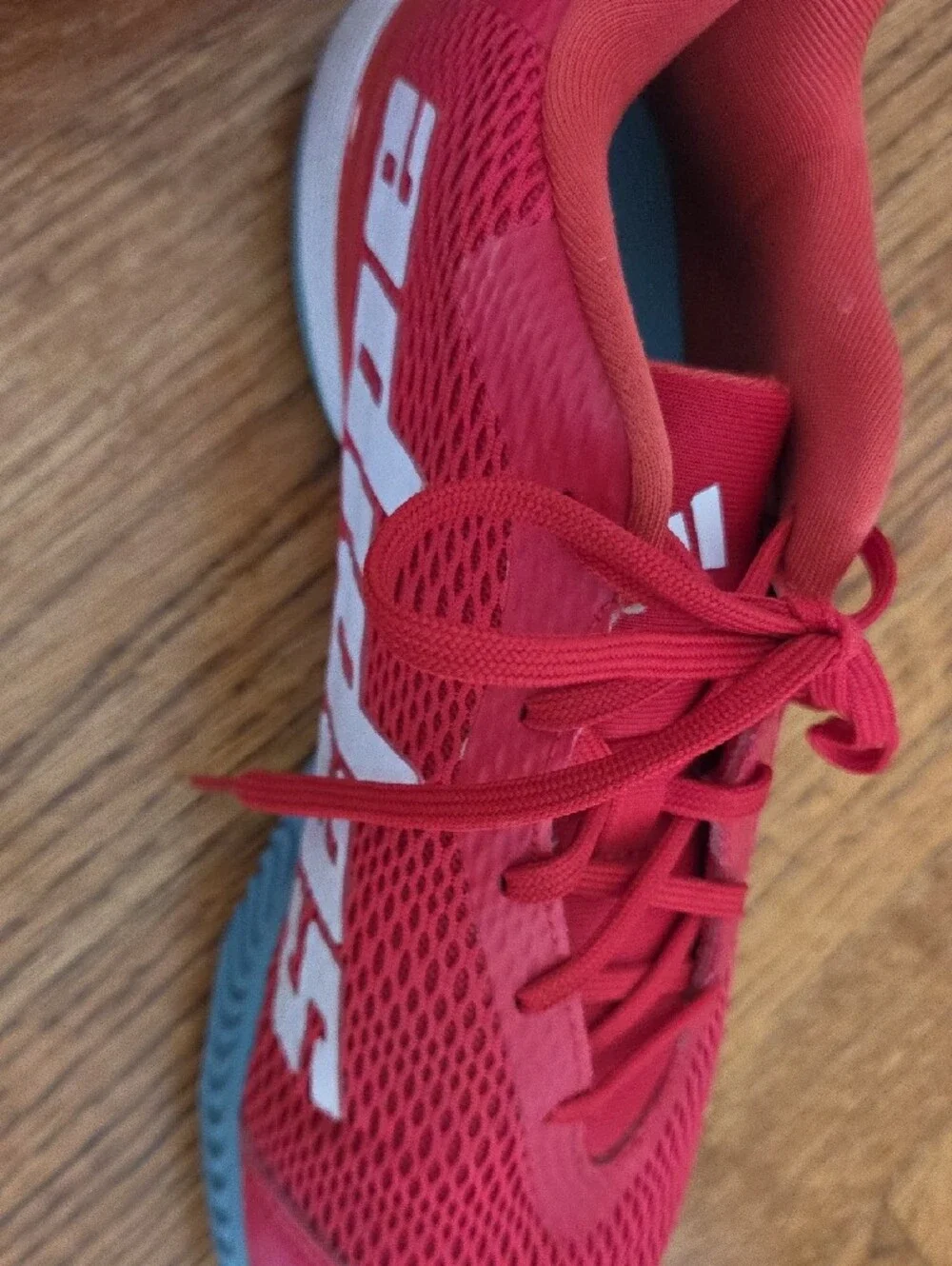 Red ADIDAS Tennis Shoes with Blue Soles